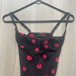 xs black corset body suit with red floral detail